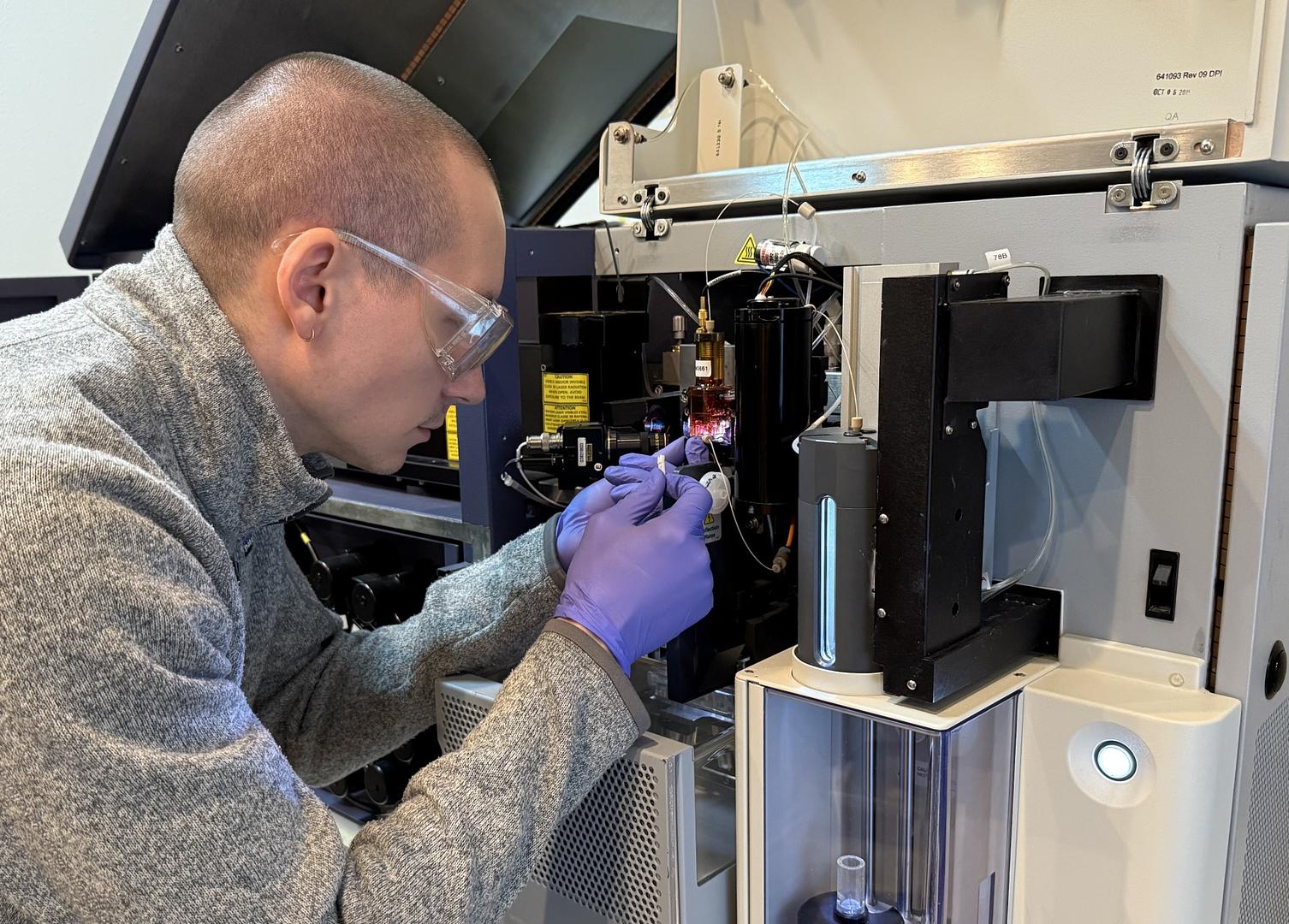 Technician standing in front of Surplus Solutions® warehouse facility.